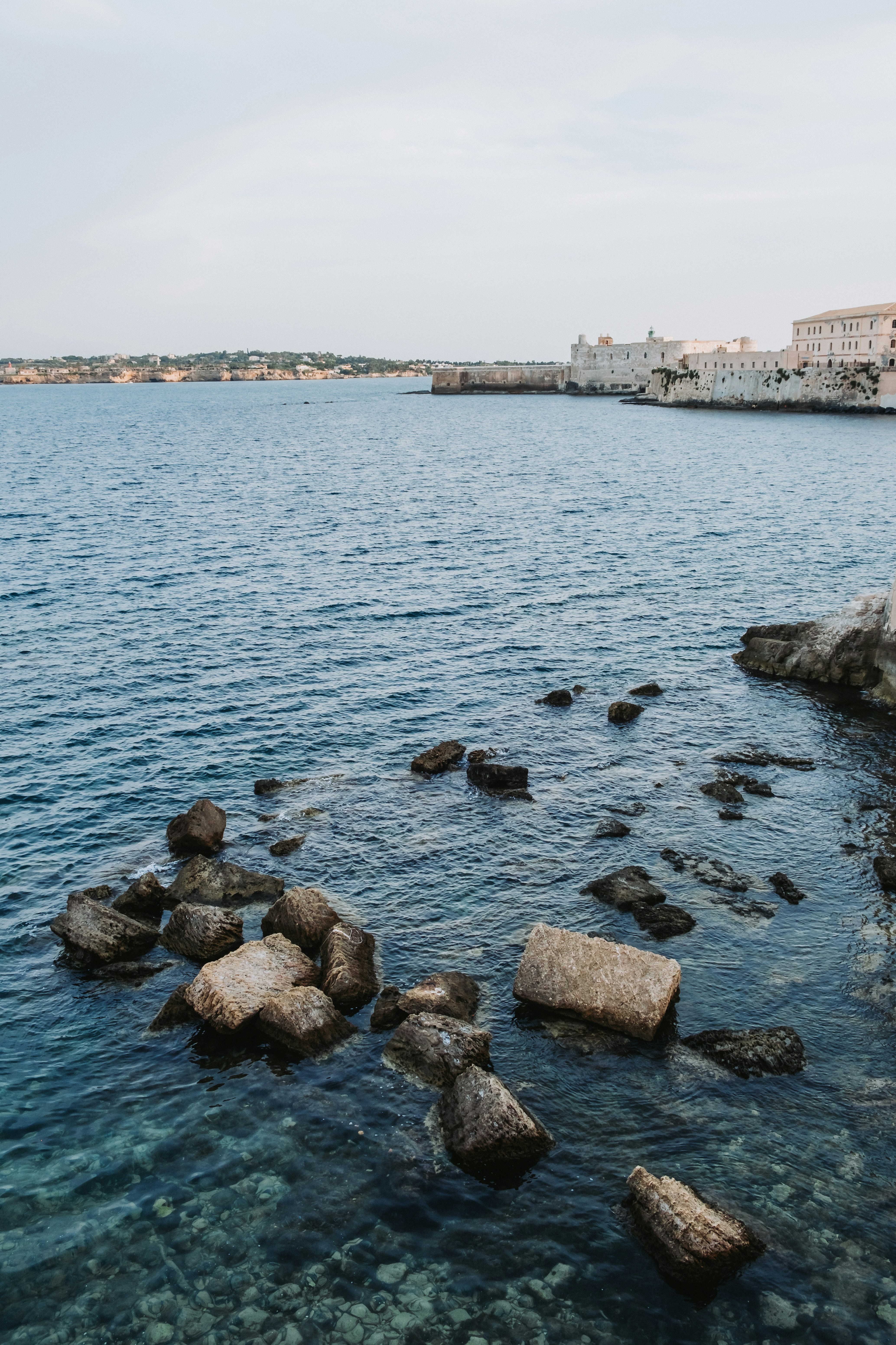 a body of water with rocks in it