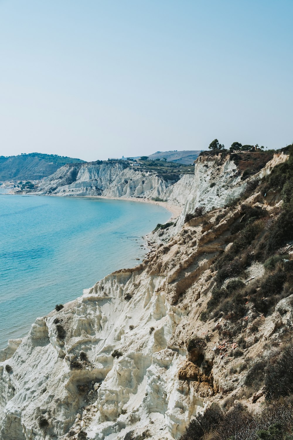 a view of a beach from a cliff