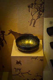 A user uploading a high-resolution image of an ancient Indus Valley seal on a sleek digital platform.