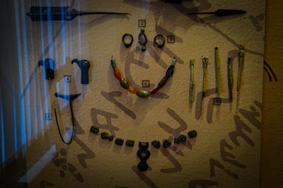 Museum display featuring authentic medieval jewelry with explanatory labels.