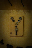 A set of various manual and digital locks displayed on a wooden table.