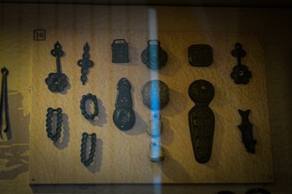 A collection of laser-cut astronomy-themed objects displayed on a wooden table.