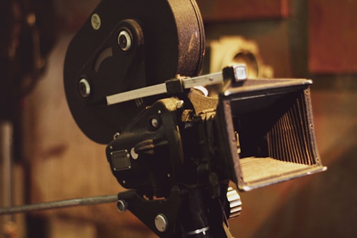 A cinematic shot of a vintage film camera with black and yellow accents, capturing the essence of Chitrakaar Film's production style.