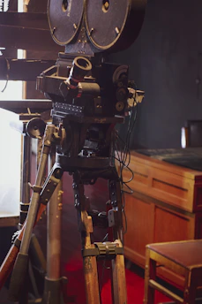 A vintage film studio with classic film equipment and soft lighting.