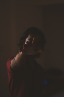 a blurry photo of a person holding a cell phone