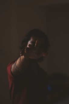 a blurry photo of a person holding a cell phone