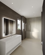 Modern attached washroom with clean tiles and essential amenities.