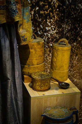A warm, inviting display of handcrafted wooden jewelry boxes with intricate carvings.