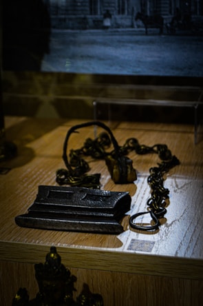 Various metal chains and clasps displayed on a white background.