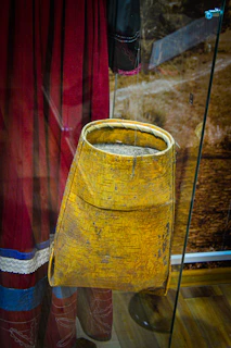 An intricate handwoven basket reflecting the craftsmanship of the myènè community.