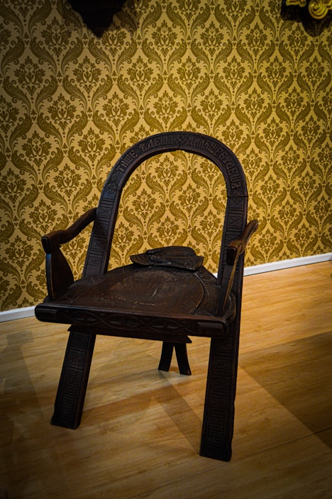 A beautifully restored antique chair showcasing intricate woodwork.