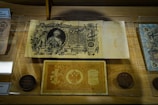 A showcase of rare coins and vintage technology.