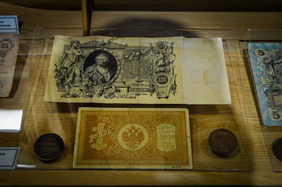 A selection of historic banknotes displayed with elegant lighting.