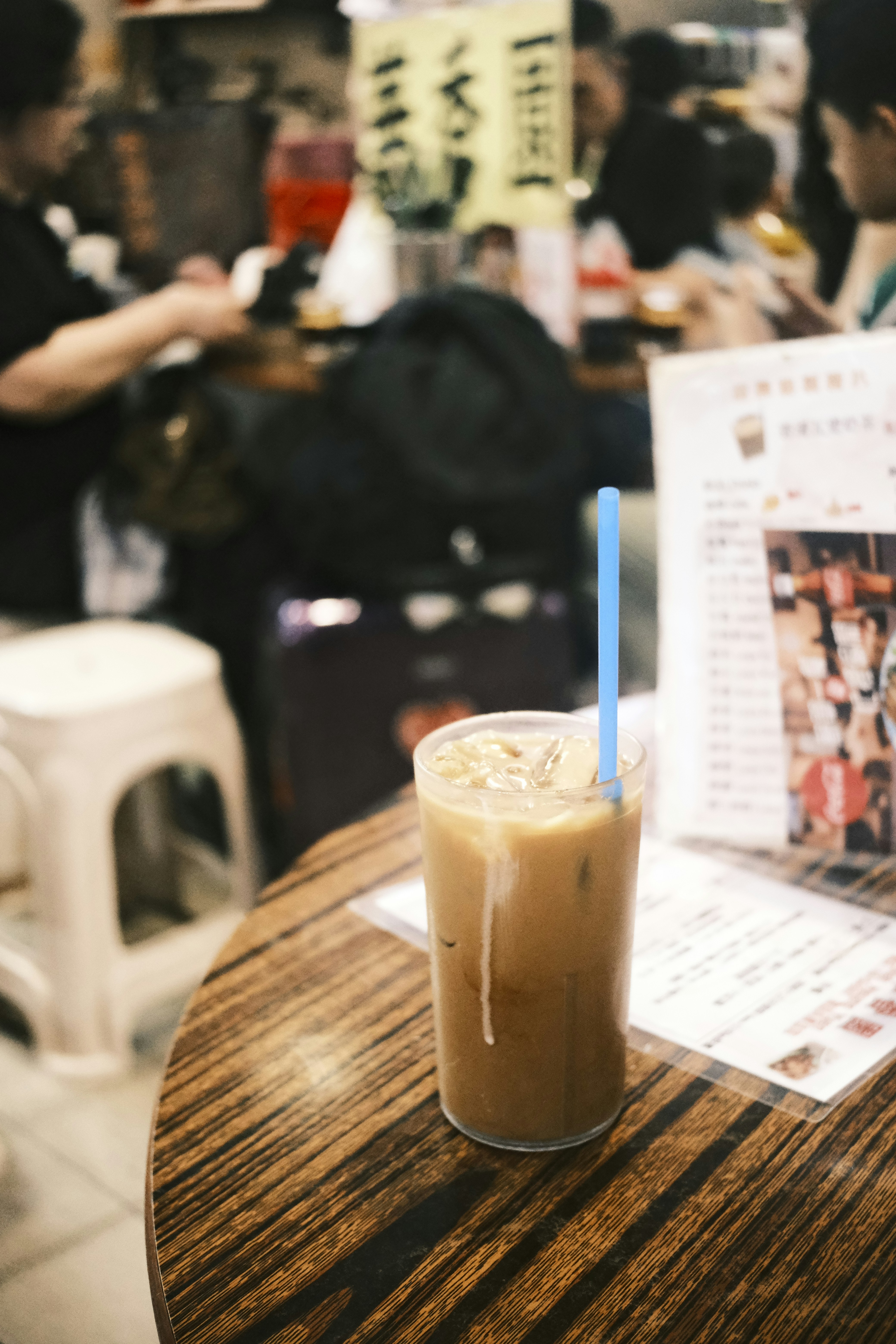 a drink sitting on top of a wooden table
