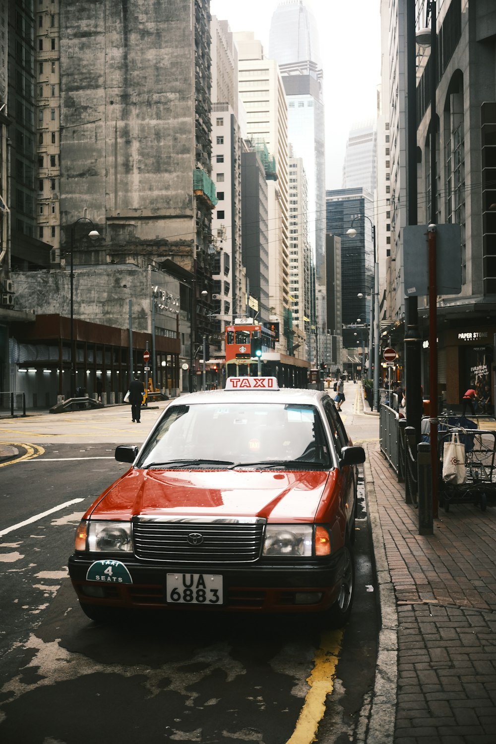 a red car parked on the side of the road