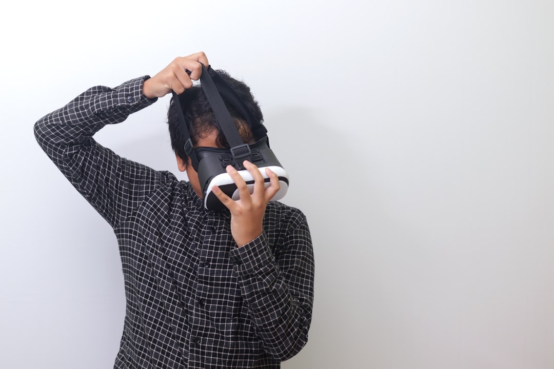 a man is holding a paper bag over his head, Asian man using Virtual Reality VR glasses and playing games