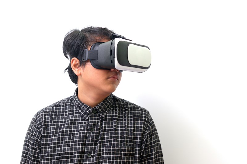 A man wearing display-equipped smart glasses, the same wearable category as the RayNeo Air 4 Pro