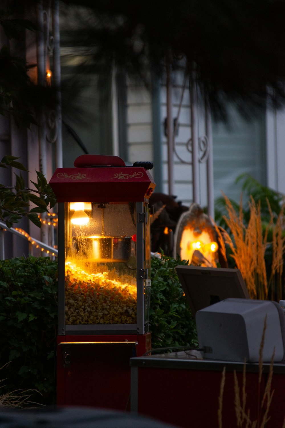 a red lantern is lit up outside of a house