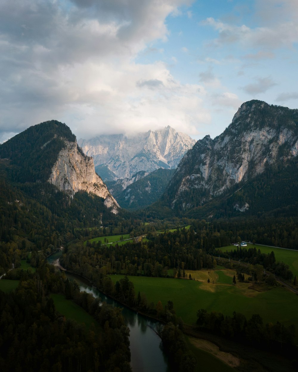 a view of a valley with mountains in the background