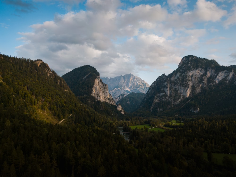 a view of a valley with mountains in the background