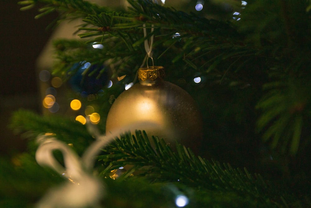 a close up of a christmas tree with ornaments