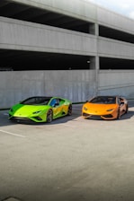 a couple of cars parked next to each other in a parking lot