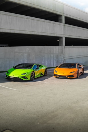 a couple of cars parked next to each other in a parking lot