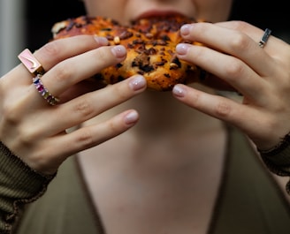 A close-up of hands exchanging gluten-free bread at a Chesed Gluten Free food distribution.