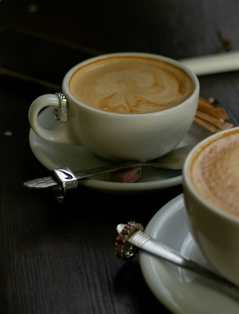 a couple of cups of coffee sitting on top of a table