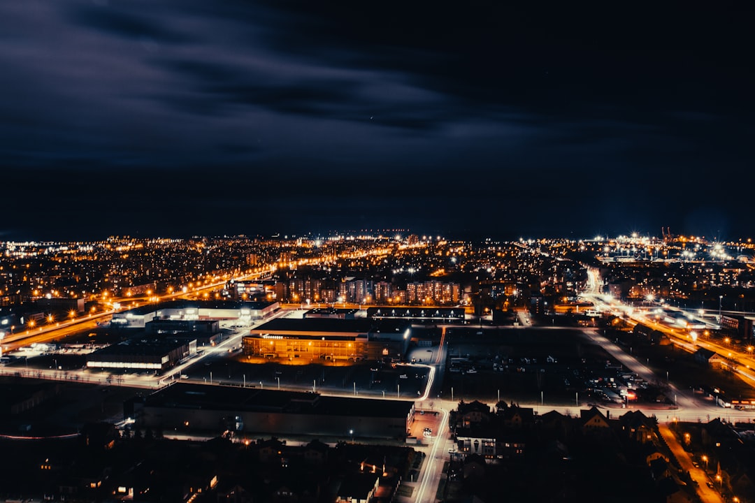 an aerial view of a city at night,