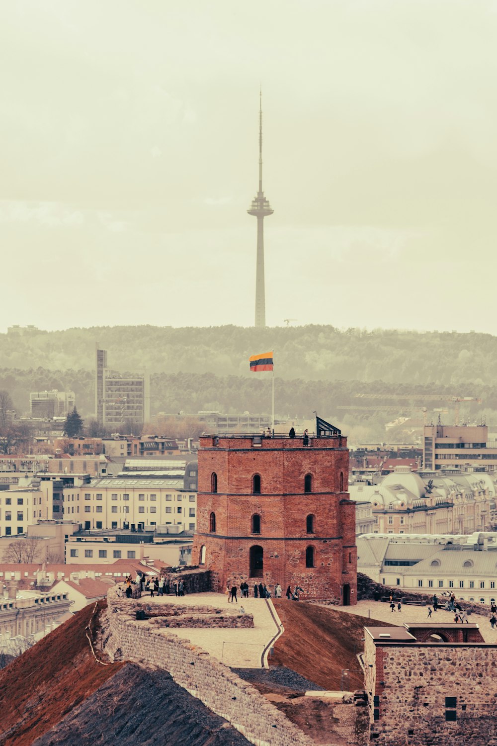 a tall tower with a flag on top of it