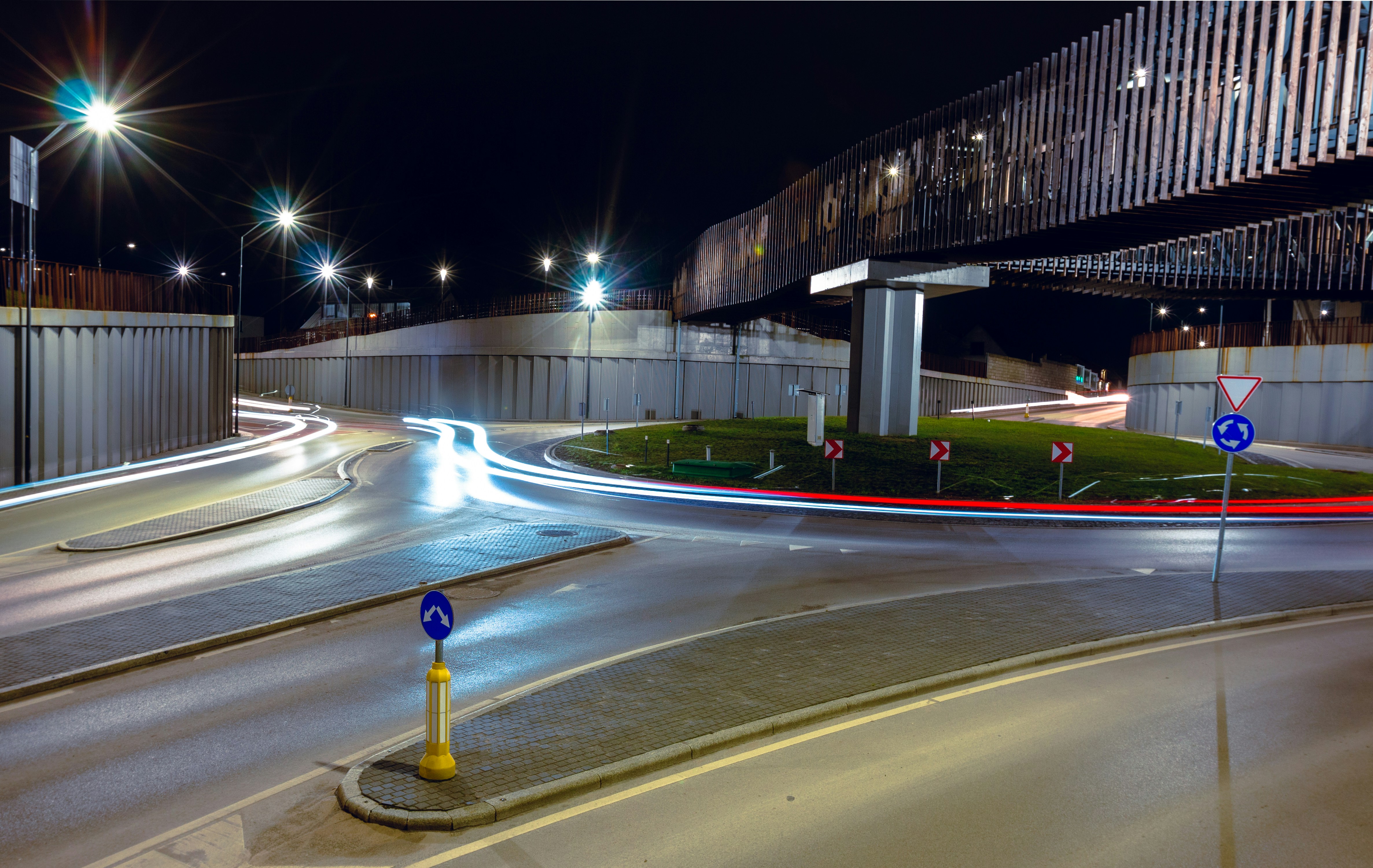 a city street at night with lights on