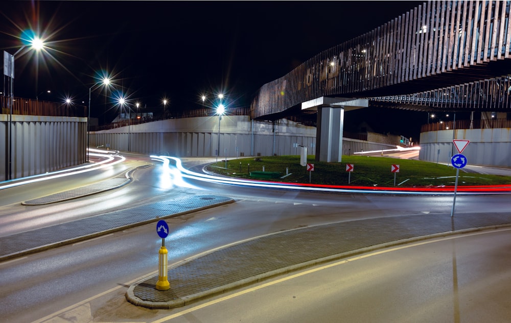 a city street at night with lights on