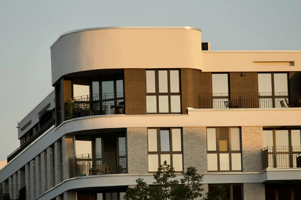 Modern apartment building facade with balconies and large windows