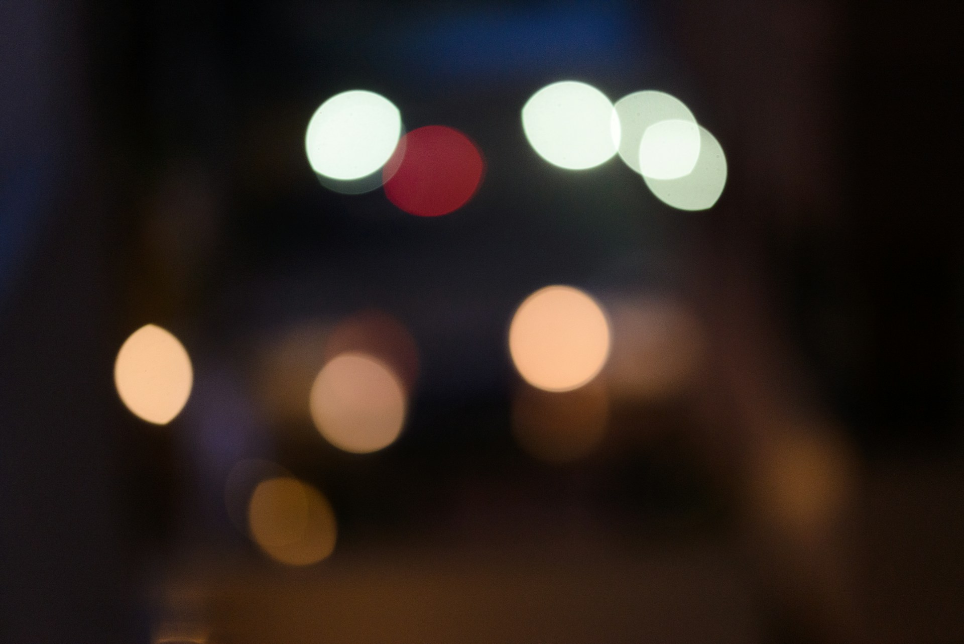 a blurry photo of a city street at night