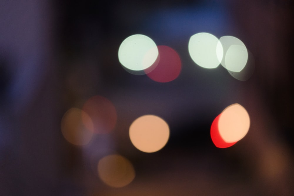 a blurry photo of a city street at night