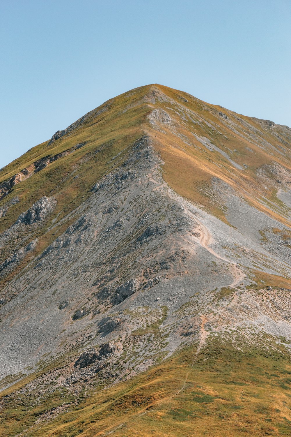 a very tall mountain with a sky background