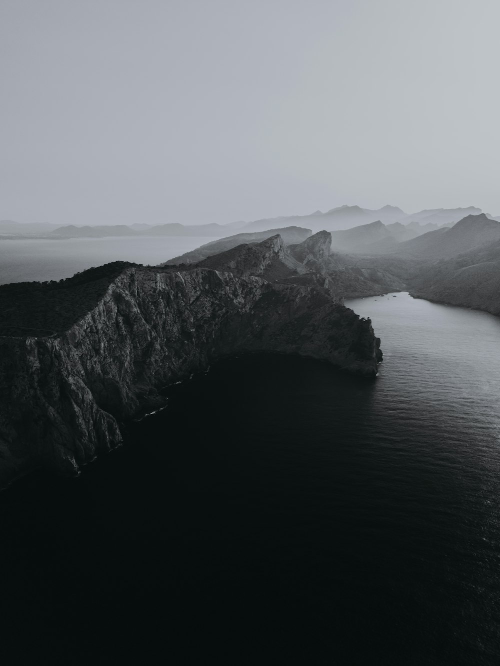 a large body of water surrounded by mountains