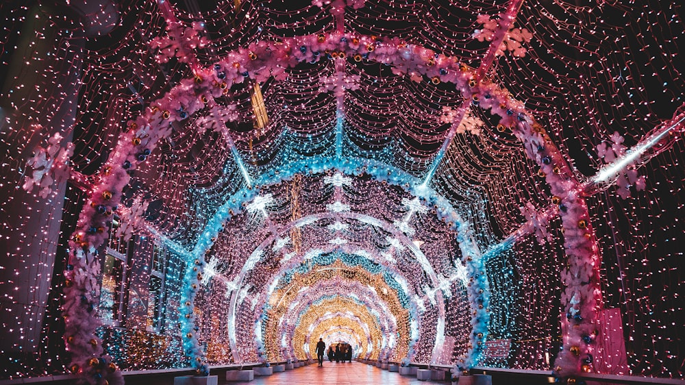 a large tunnel with lights and decorations on it