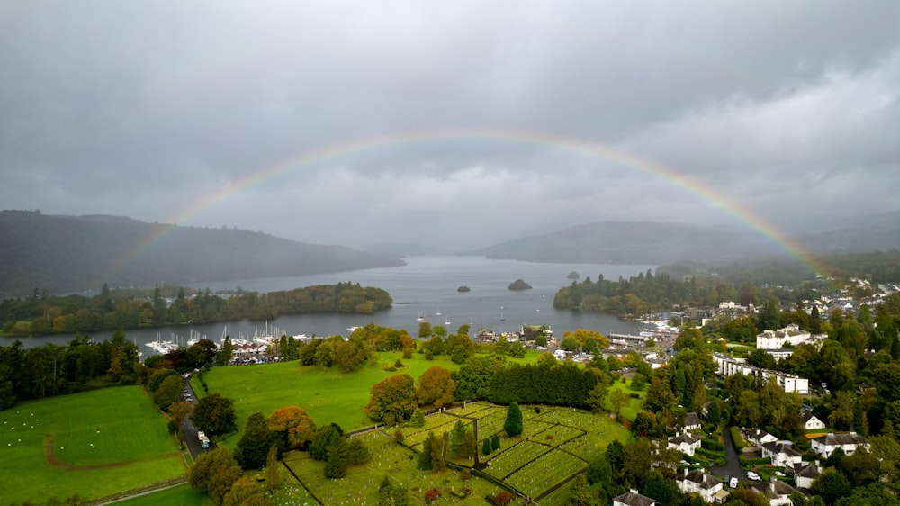 a rainbow in the sky over a small town