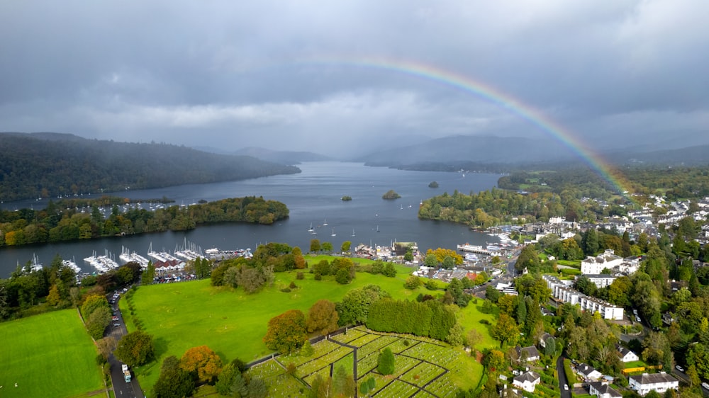 a rainbow in the sky over a small town