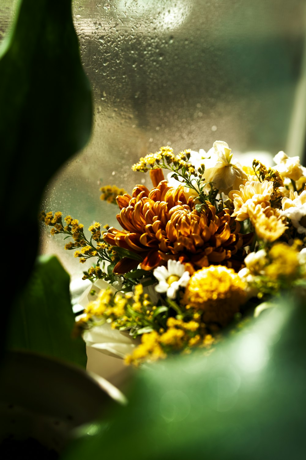 a bunch of flowers sitting on top of a table