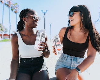 a couple of women sitting next to each other