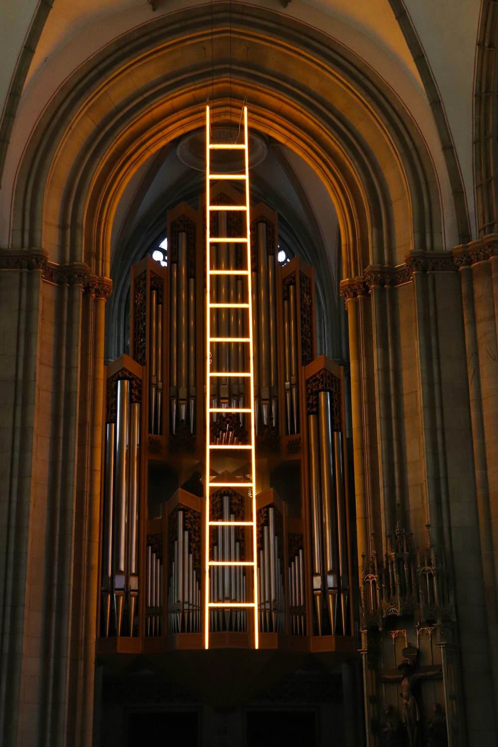 a ladder lit up in the middle of a church