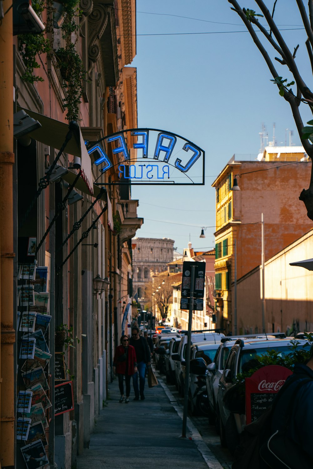 a street with cars parked on the side of it