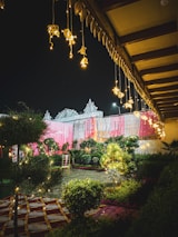 An outdoor garden venue ready for a baby shower, featuring colorful decorations and seating.
