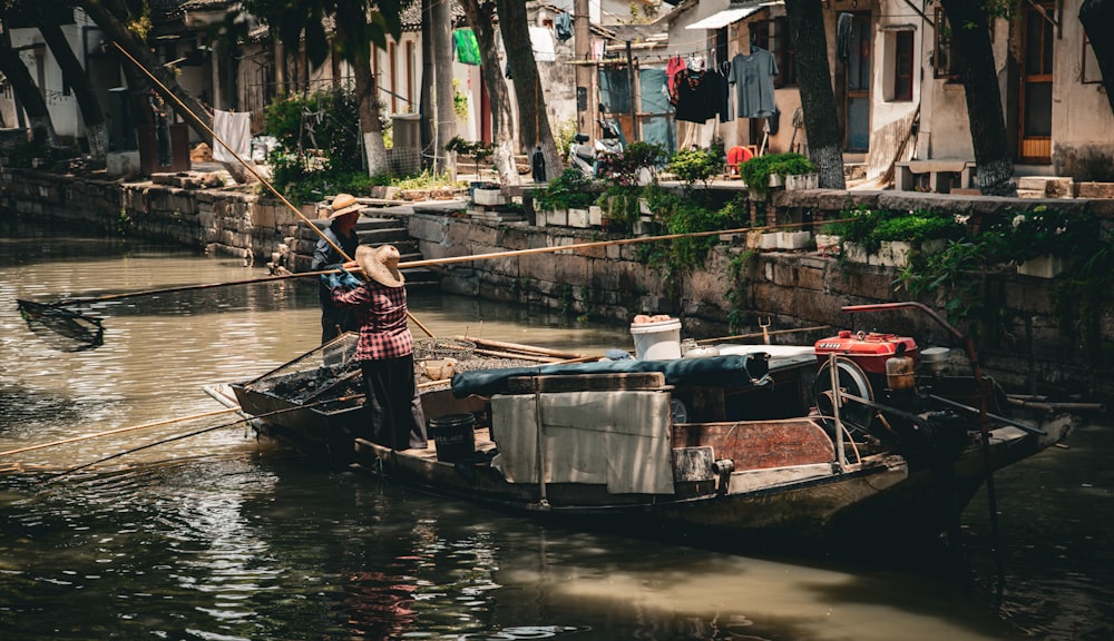 a man standing on a boat in a river