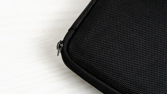 Close-up of a bright blue storage bag with a smooth zipper and soft fabric texture.