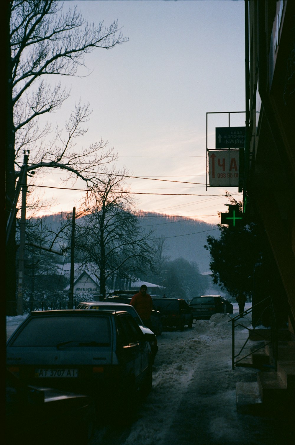 a street with cars parked on the side of it