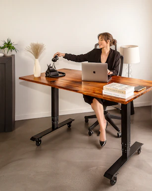 A professional lawyer's office desk with legal books and a phone ready for client calls.